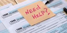 Need Help written on post it note on tax form